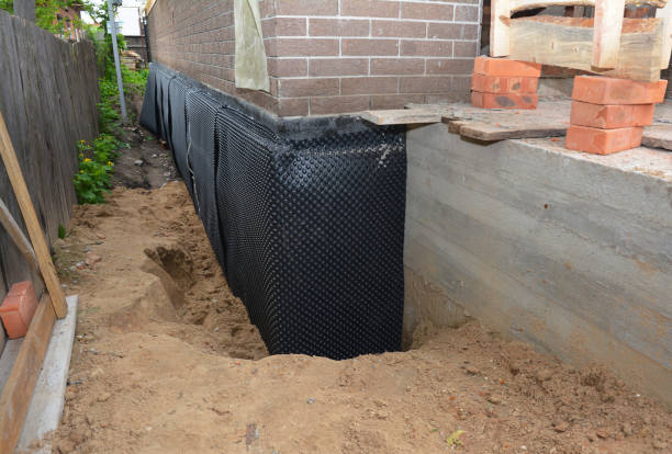 Happy homeowners after waterproofing job in Rogersville